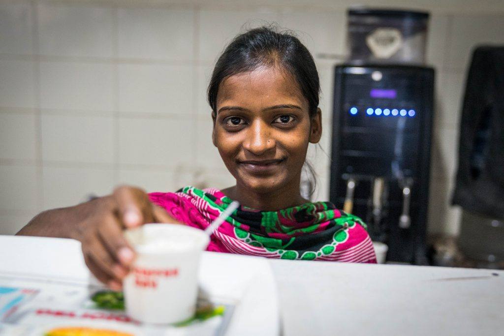 Soni Kumar, a beneficiary of the adolescent girls empowerment programme, at her coffee station Aims Hospital in Patna where she earns a living. (Photo: AKDN)