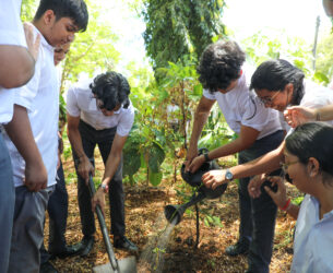 Students plant a tree in Tanzania