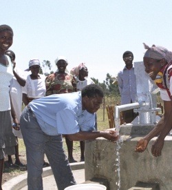 Villagers using a new water pump in rural Kenya