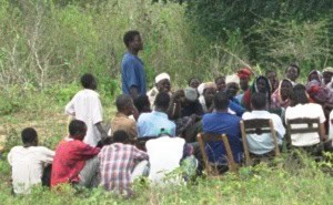 Villagers in Kenya attend a meeting to start a local savings program.