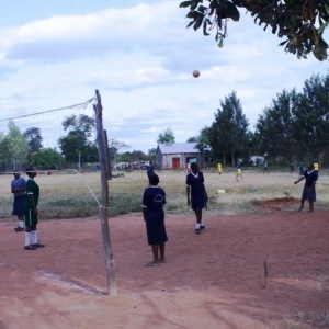 Students play volleyball at the secondary school founded by MCDA. 