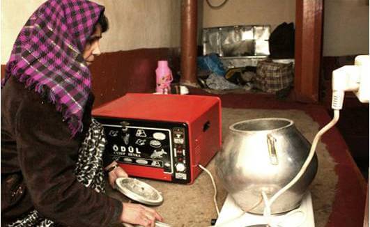 woman cooking on an electric stove