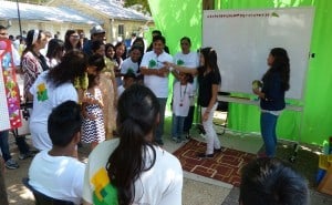Volunteers and participants watching a Village In Action skit at the 2015 Aga Khan Foundation Walk|Run - San Antonio.