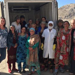 Members of a dairy-focused common interest group in Dusti, Tajikistan stands around their new refrigerated truck. Photo Credit AKDN