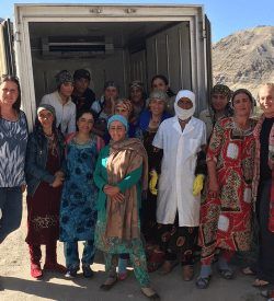 Members of a dairy-focused common interest group in Dusti, Tajikistan stands around their new refrigerated truck. Photo Credit AKDN