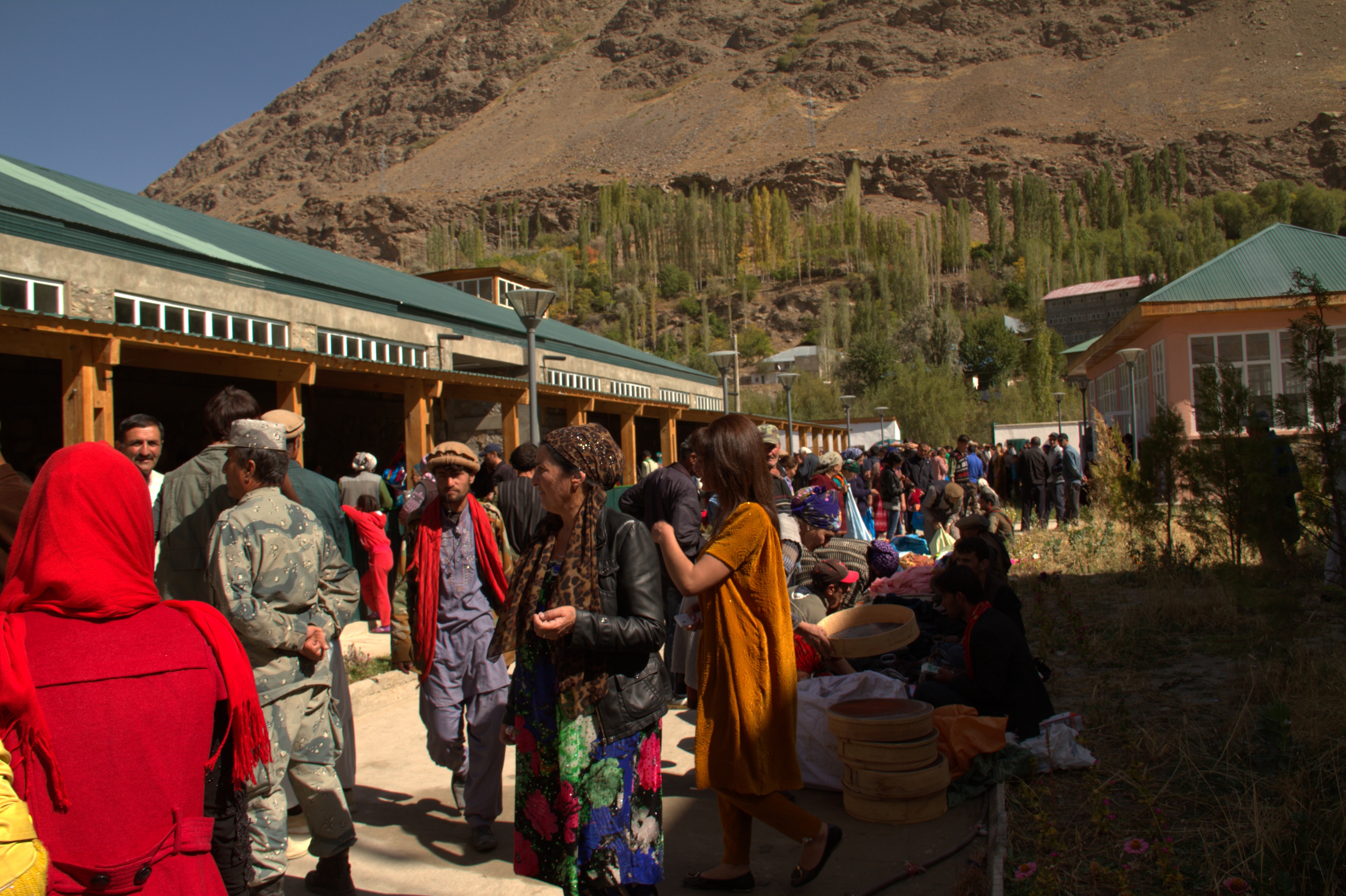 The crossborder market outside of Khorog, Tajikistan, in the village of Tem, is a cultural and economic hub. Once a week, buyers, sellers, and traders from all parts of Northern Afghanistan are allowed to cross the bridge to Tajikistan and sell traditional handicrafts, produce and other goods. The region around the Panj River is called Badakhshan, which has historically shared the same dialect, culture, and customs. Many people have family on both sides of the river, in Afghanistan and Tajikistan. (Photo: Dilafruz Khonikboyeva/AKDN)