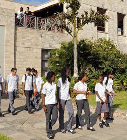 Kids walking out of a building at the Aga Khan Academy in Mombasa. (Photo: AKDN)