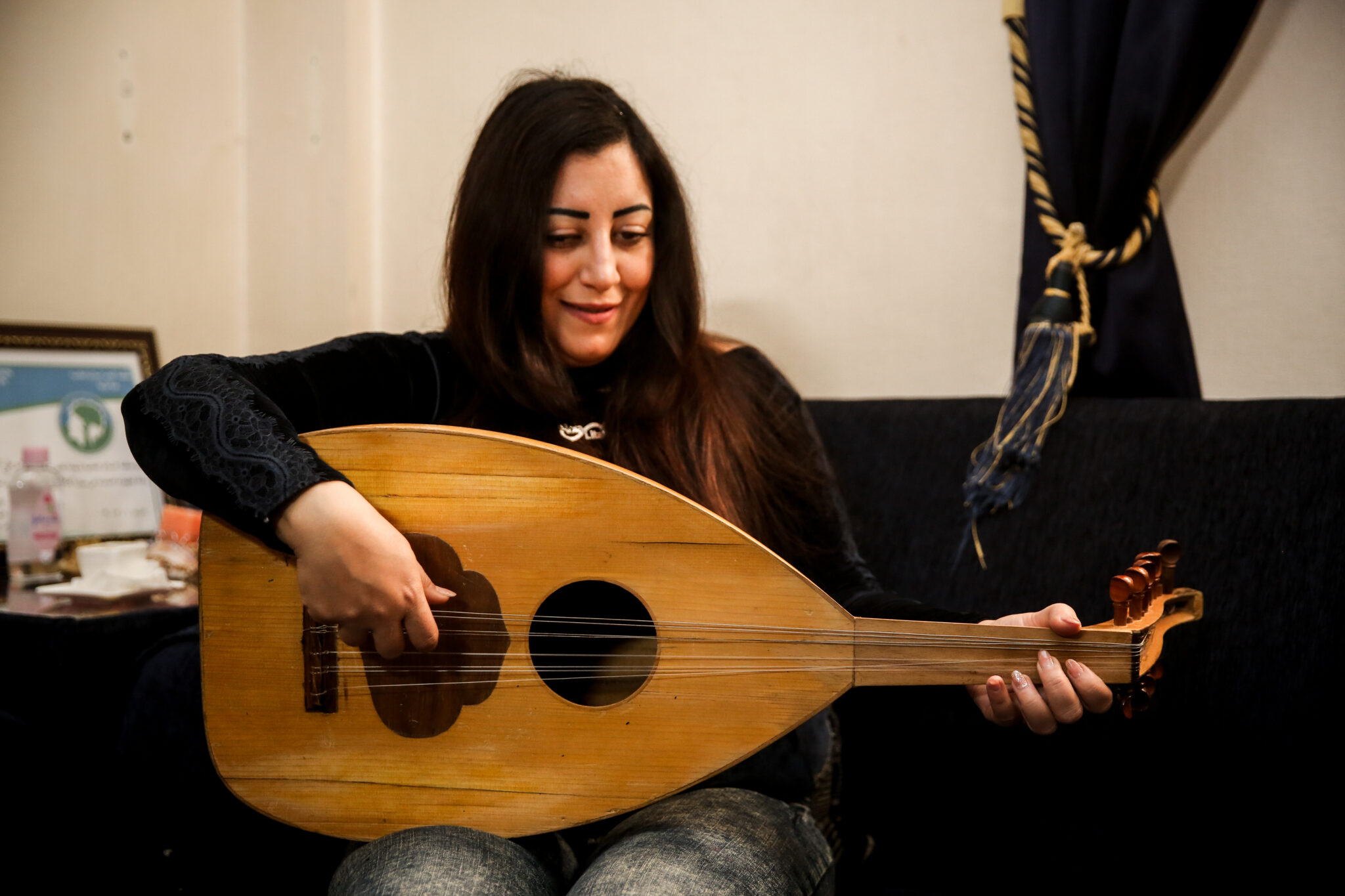 In her spare time, Rola enjoys playing the oud at home, a traditional stringed instrument | AKF / Ali Shaheen