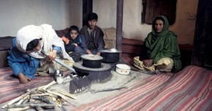 A family using their new environmentally friendly stove in Pakistan