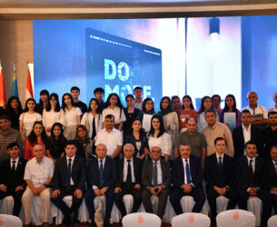 A group photo of graduates and officials at the graduation of UCA SPCE students.