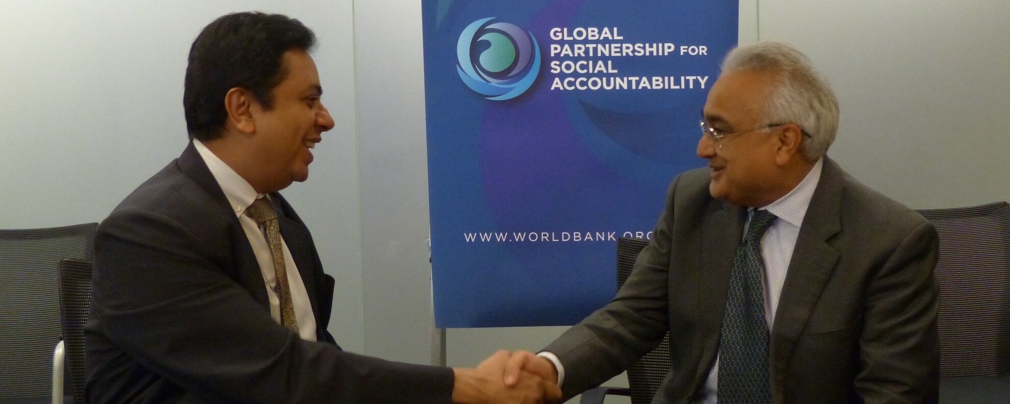 Representing the World Bank Group, Mr. Sanjay Pradhan, Vice President for Change, Knowledge and Learning, shakes hands with Dr. Mirza Jahani, CEO of Aga Khan Foundation U.S.A