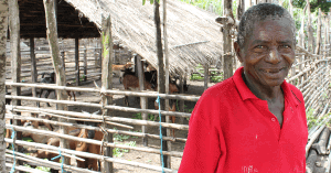 Gabriel standing outside of his goat pen. He has farmed his entire life and after a livestock association was formed in his village, he started making extra money by breeding goats.