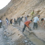 Villagers working together on a new irrigation canal in Vazgulam Valley, Tajikistan