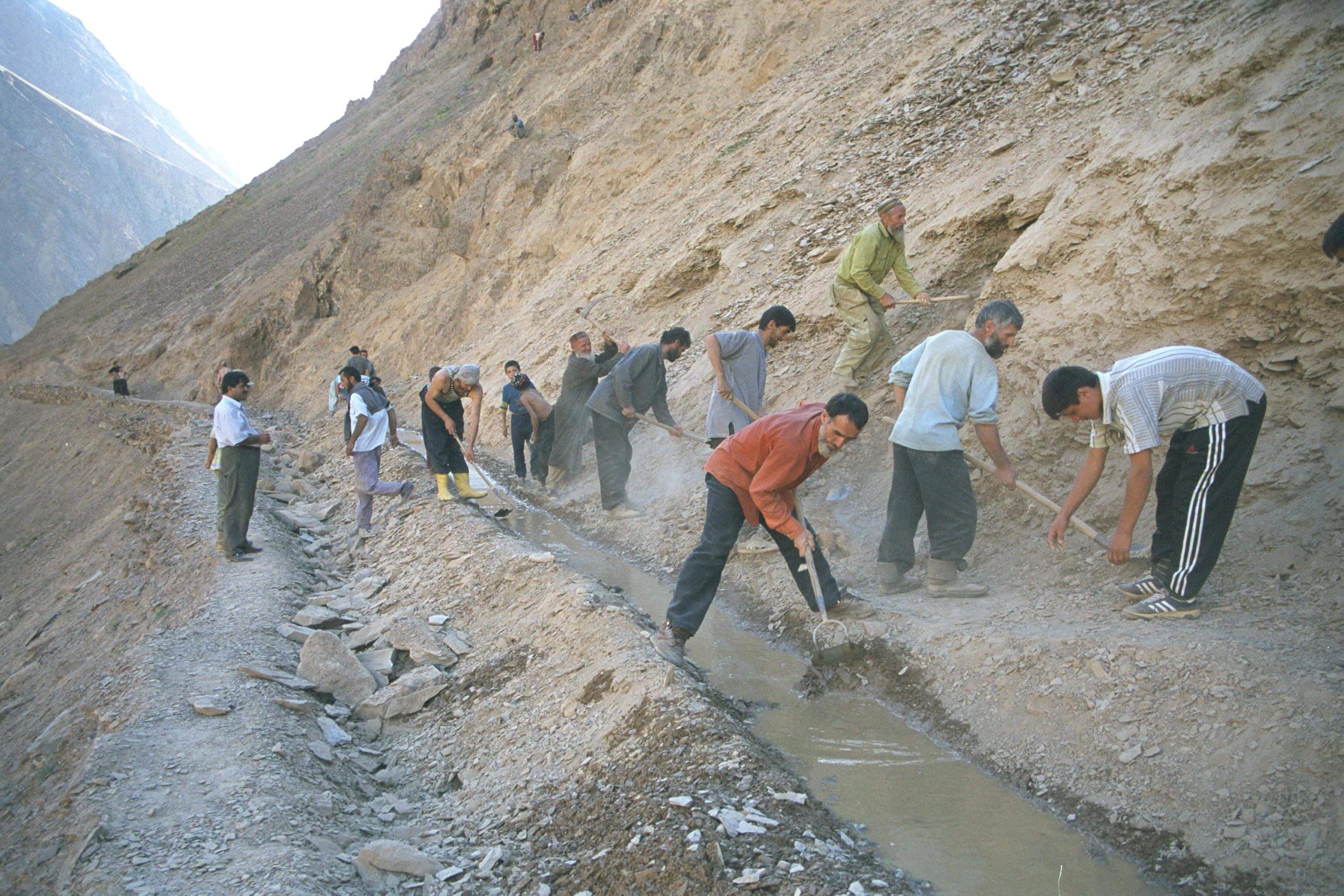 Villagers working together on a new irrigation canal in Vazgulam Valley, Tajikistan