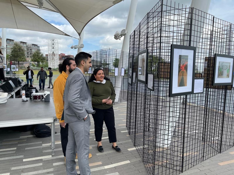 Youth Ambassador Alumni view the art entries at the Youth Festival 2024