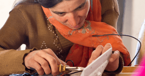 Pakistani woman practicing electrician skills.