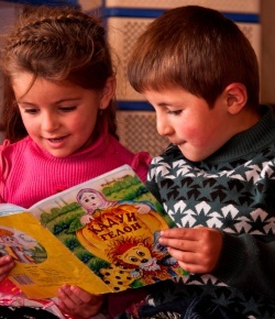 Two children reading as a part of the Reading for Children program in Tajikistan