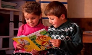 Two children reading as a part of the Reading for Children program in Tajikistan