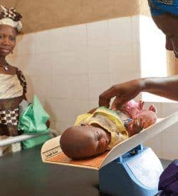 Up until 2008, the lack of quality health services in Mopti had resulted in a particularly high incidence of maternal and newborn death. In response, AKF helped establish a number of cases de santé, built by the villagers, with the assistance of the Foundation, which supplied the architect and master mason. These health huts, staffed by community health workers trained by AKF, certified by the Ministry of Health and paid for by the community, have had an immediate positive impact: no maternal deaths and only one newborn death have been reported since 2008. Photo Credit: Lucas Cuervo Moura/AKDN